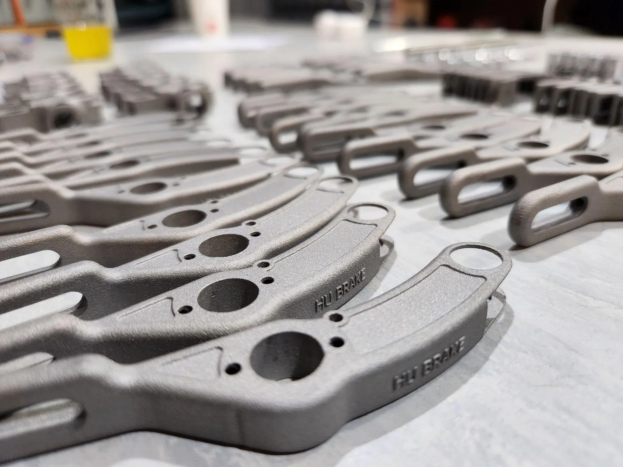 3D printed brake calipers on a workbench